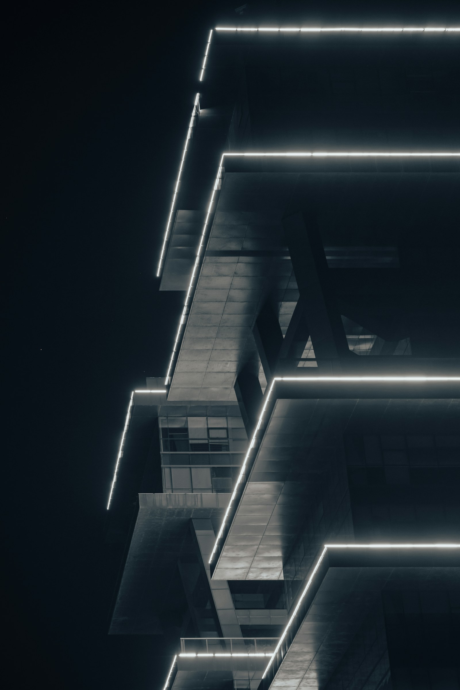 Precision-lit architecture representing ambitious growth